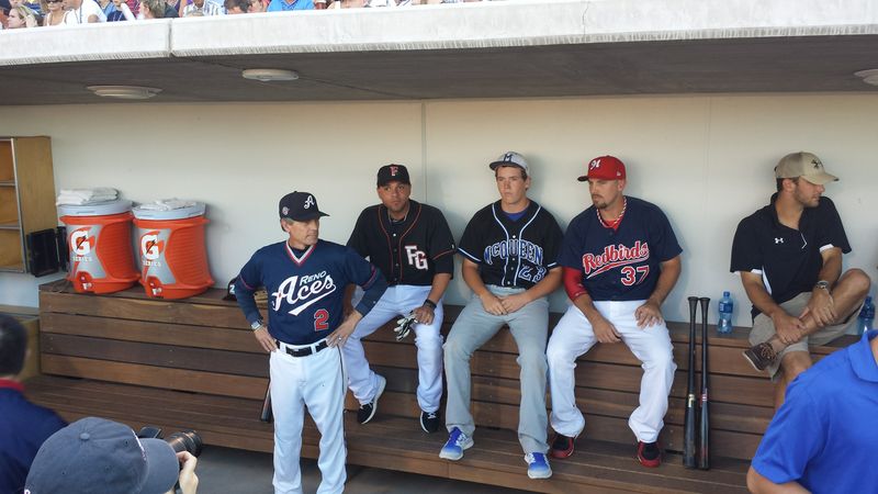 (Jared Ravich/MiLB.com) Brock watches from the dugout with Reno Manager Brett Butler, Johnny Monell and Kody Reynolds.